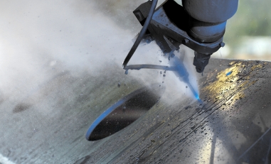 Macro waterjet cutting of steel plate. 